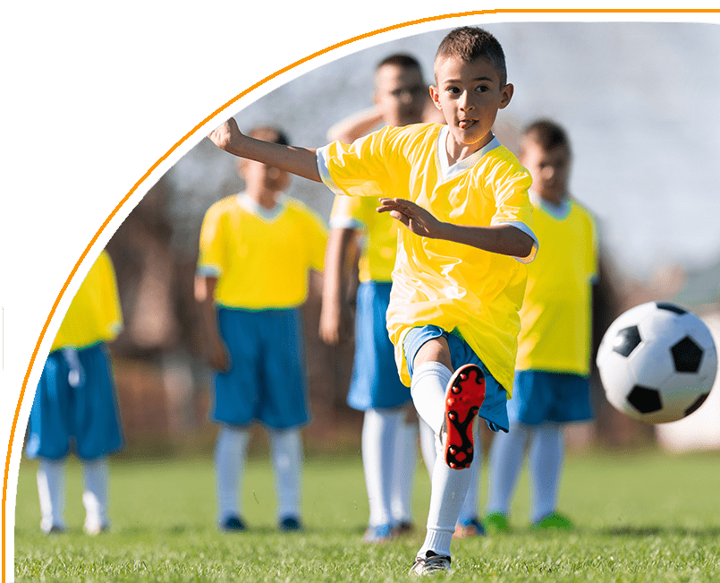 A group of young boys playing soccer on the field.